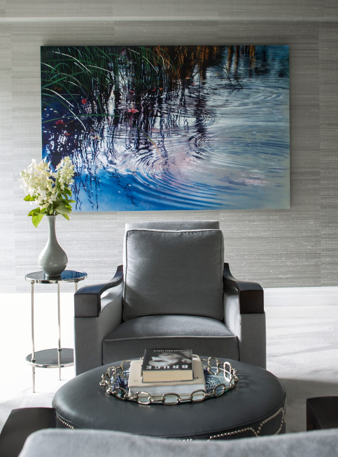 Modern living room with wall art and stylish armchair.