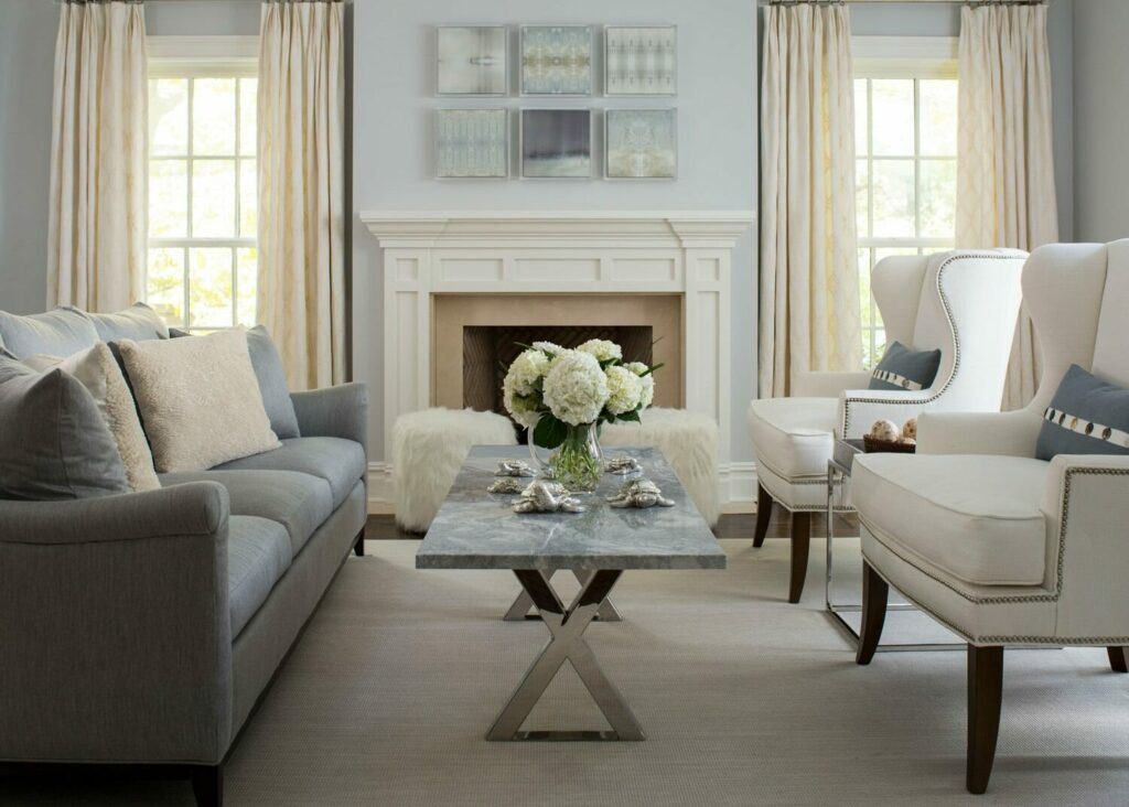 Elegant living room with fireplace and neutral decor.