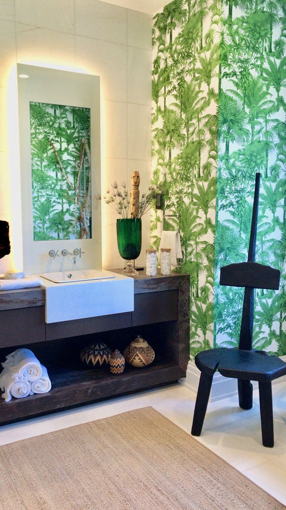 Tropical bathroom decor with fern wallpaper and modern vanity
