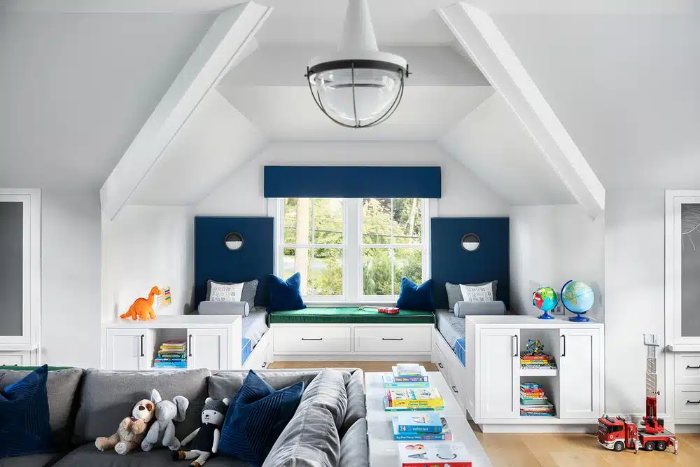 Modern children's playroom with cozy reading nook.