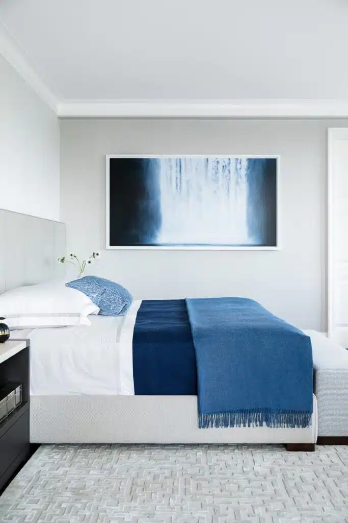 bedroom with blue and white bedding