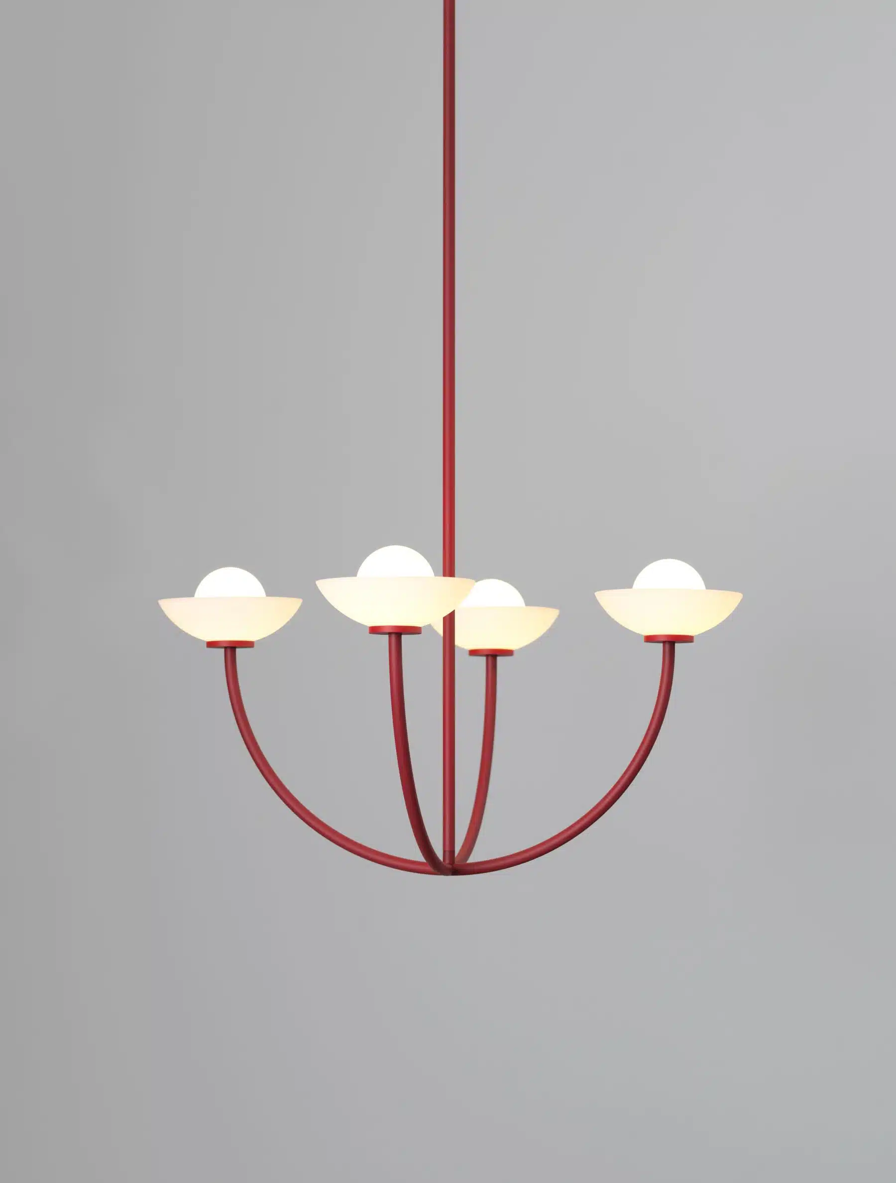 Modern red chandelier with four white lampshades.