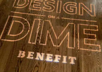 Housing Works Design on a Dime Benefit logo on floor.