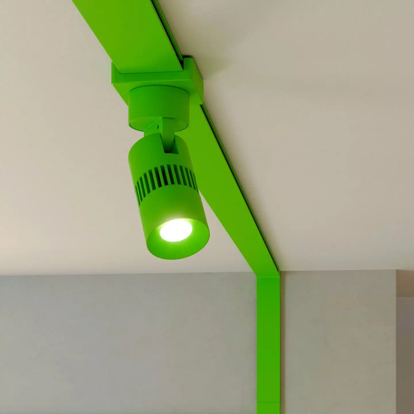 Green track lighting fixture on ceiling.
